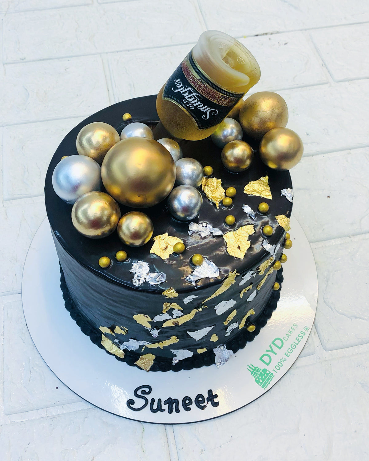 Black Cake With Alcohol Bottle