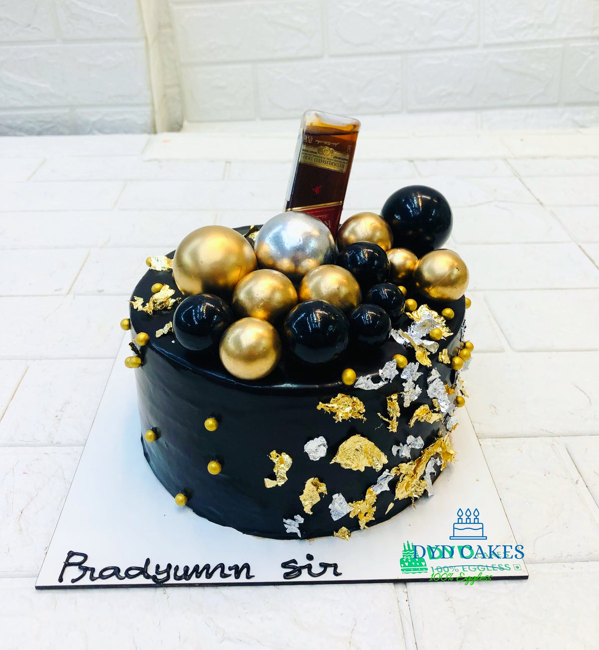 Black Cake With Alcohol Bottle