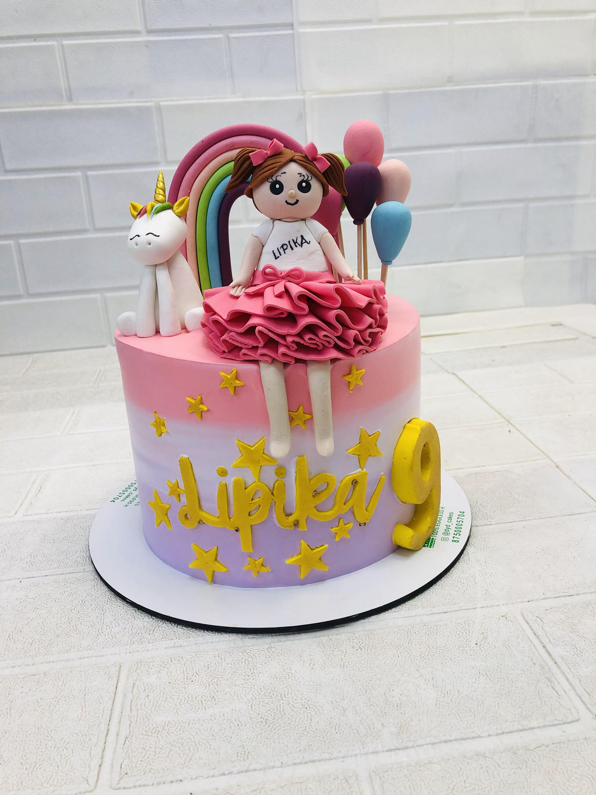 Girl With Rainbow Unicorn Cake