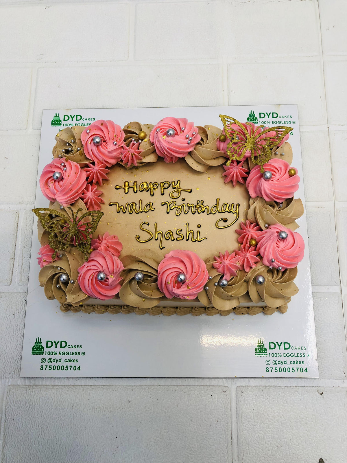 Brown Cake With Pink Flower Design